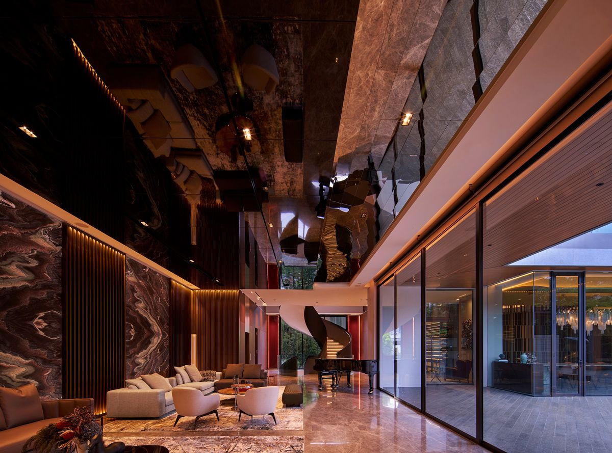 The Good Class Bungalow’s mirrored ceiling doubles the grandeur of the immaculately furnished living room