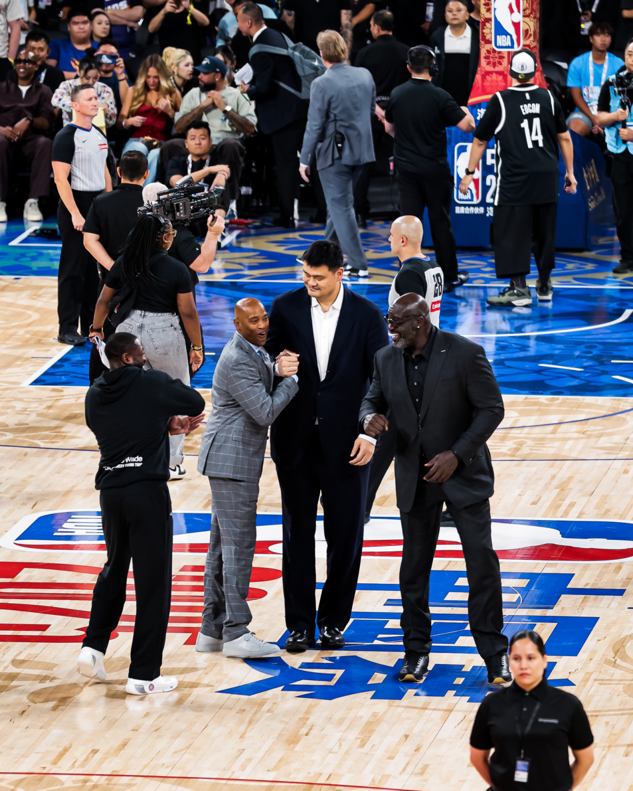 NBA legends Vince Carter, Yao Ming and Shaquille O'Neal on the court floor at the NBA China Games 2025