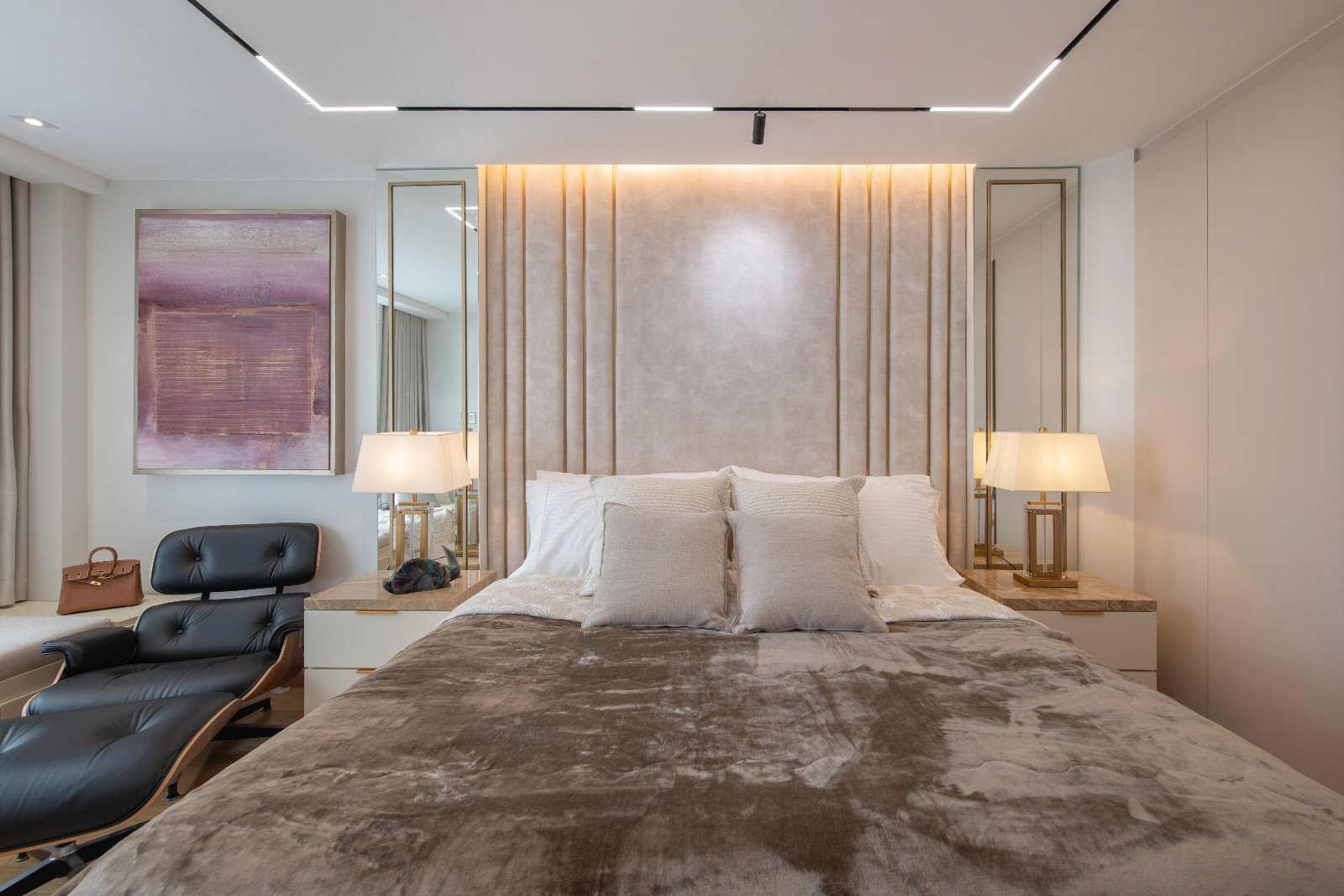 The primary bedroom of a Makati home designed by architect Freddy Bautista, alongside interior designers Loubs and Ricia Gardiola