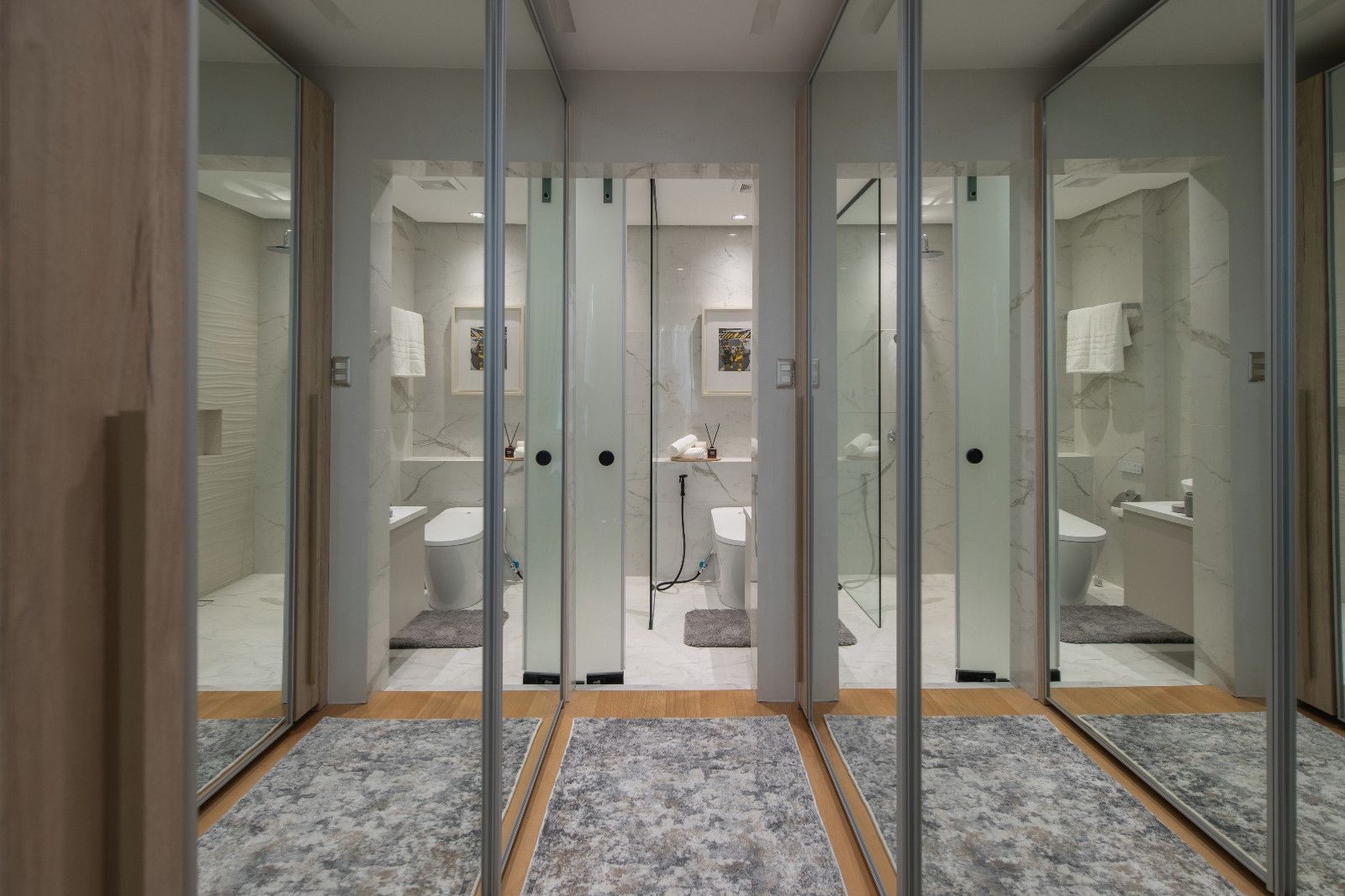 The ensuite bathroom and walk-in closet of a Makati home designed by architect Freddy Bautista, featuring an expansive collection by Filipino artists