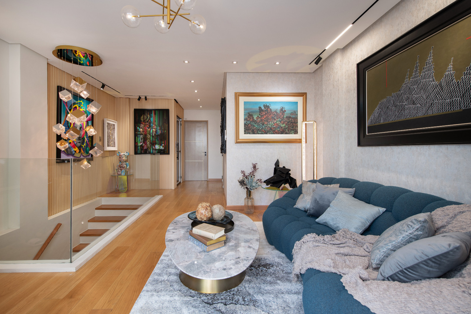 The family room of a Makati home designed by architect Freddy Bautista, alongside interior designers Loubs and Ricia Gardiola, featuring an expansive collection by Filipino artists