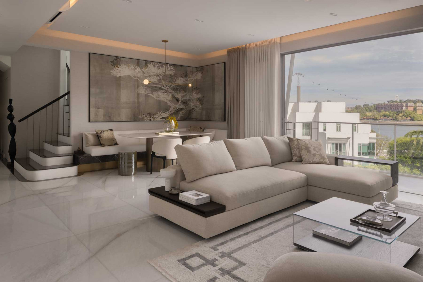 The open-plan living and dining area flows seamlessly to the balcony