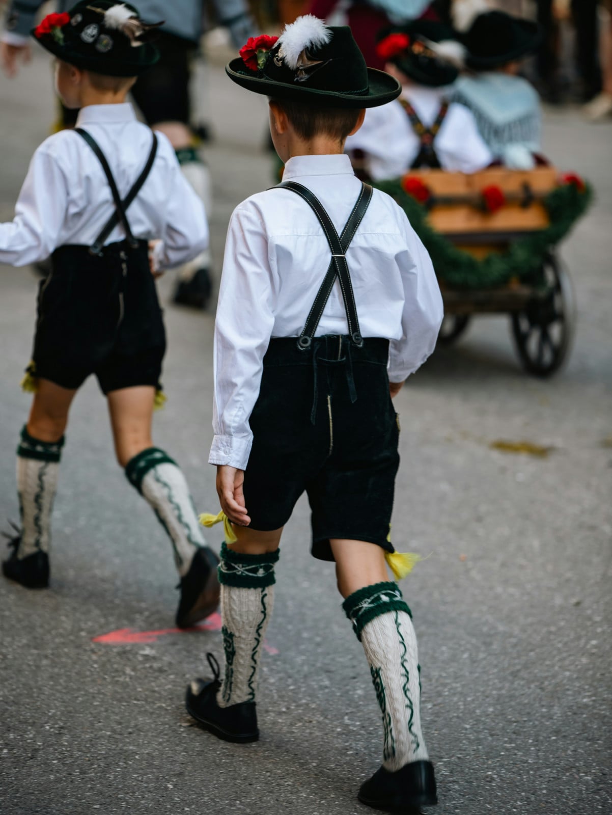 Young boy wearing traditional lederhosen at Oktoberfest in Munich