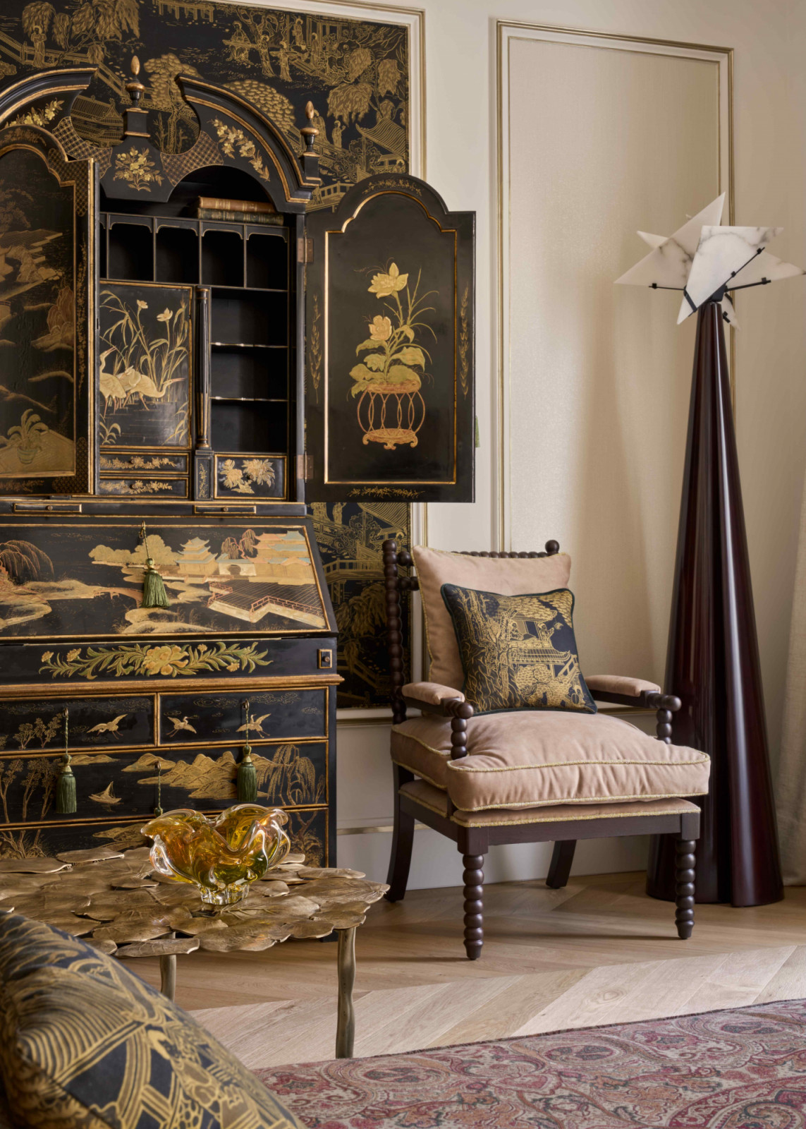 Hand-sourced antiques paired with custom made armchairs and contemporary furnishings add layers of cultural narrative