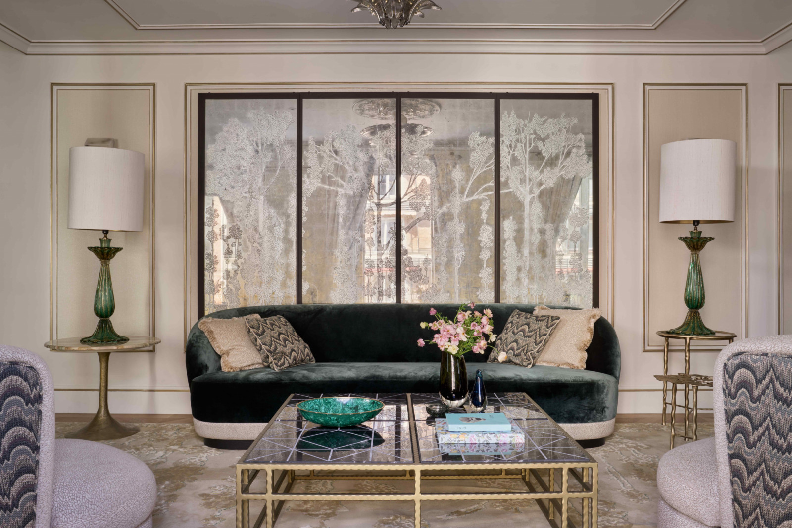 The custom gilded glass folding screen is the pièce de résistance in the apartment