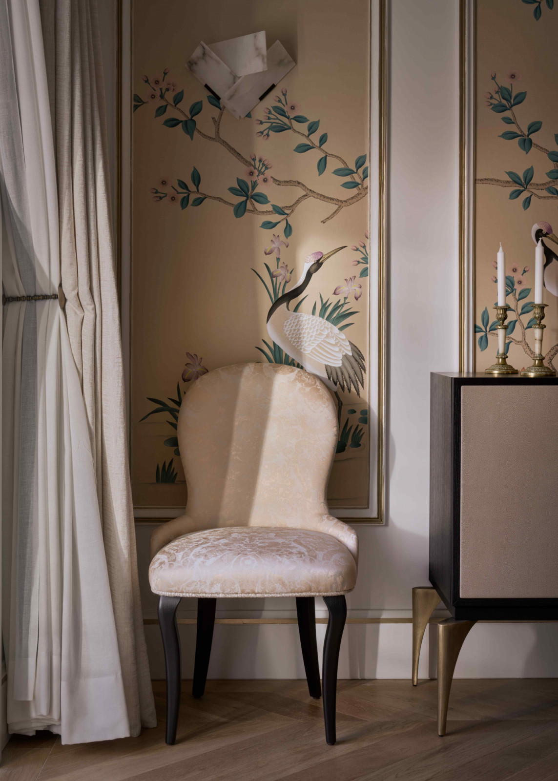 Hand-painted wallpapers with flora and fauna motifs create vibrant yet serene backdrops