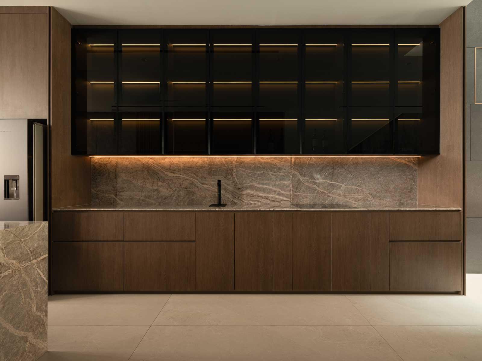 Fior di Pesco marble grounds the sleek kitchen