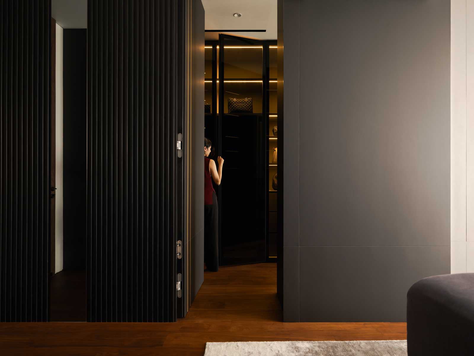 A stylish passage leads to the walk-in wardrobe