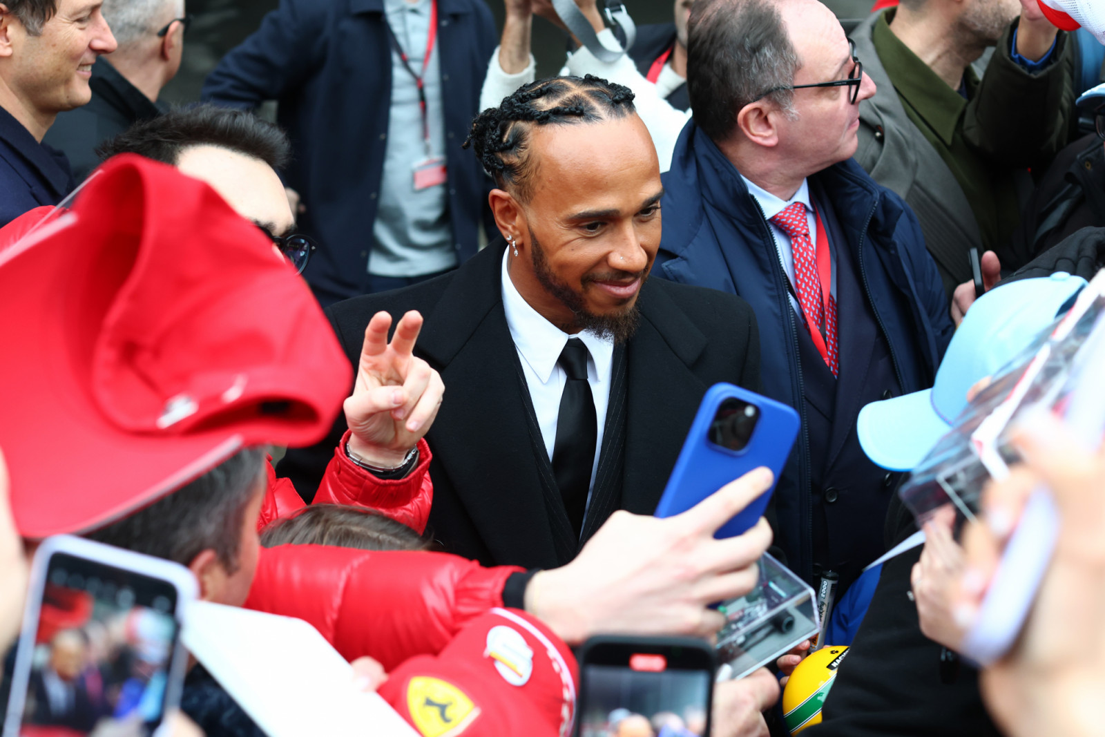 FIORANO MODENESE, ITALY - JANUARY 20: Sir Lewis Hamilton greets fans during his first official days as a Scuderia Ferrari F1 driver at Fiorano Circuit on January 20, 2025 in Fiorano Modenese, Italy. (Photo by Clive Rose/Getty Images)