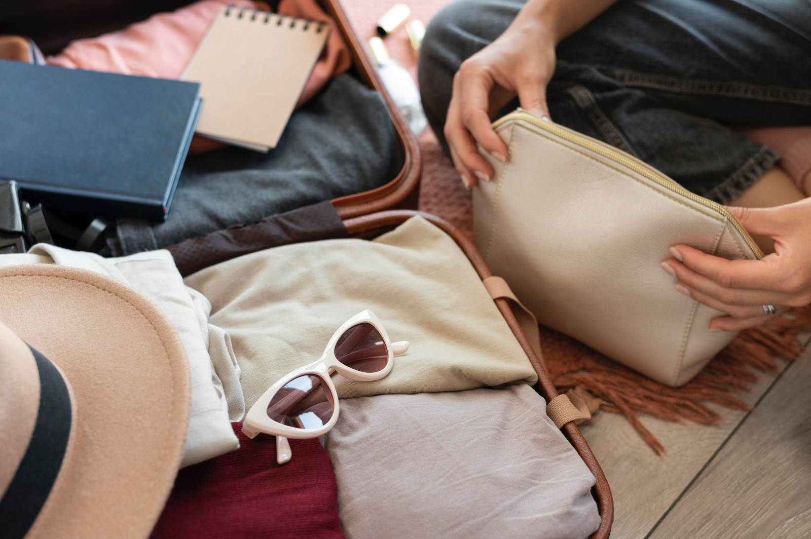 Streamline your toiletry kit by swapping bulky bottles for solid alternatives and refillable minis that meet liquid limits and save space. (Photo: Freepik)