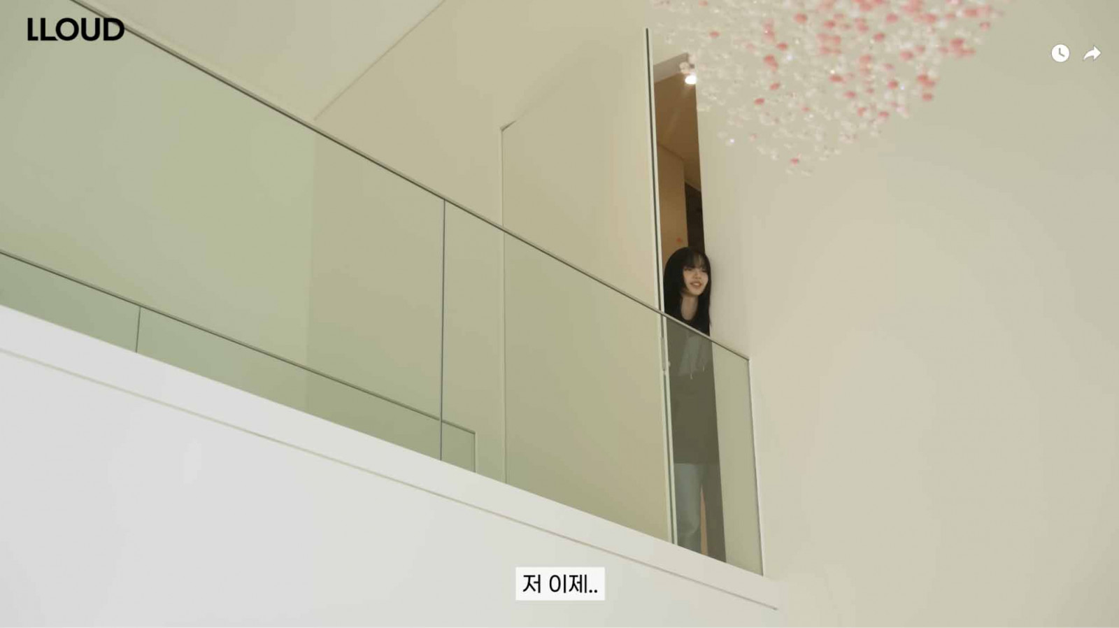 Blackpink’s Lisa peeking out from the second level of her home (Photo: Youtube / LLOUD Official)