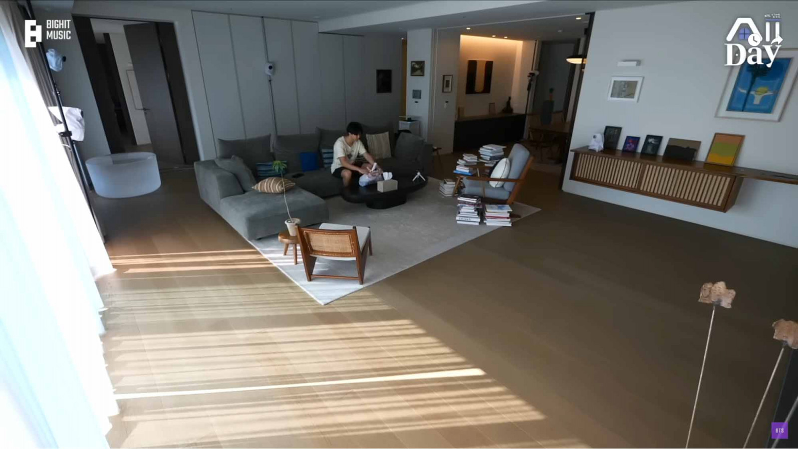 Namjoon relaxing in his living room (Photo: Youtube / BANGTANTV)