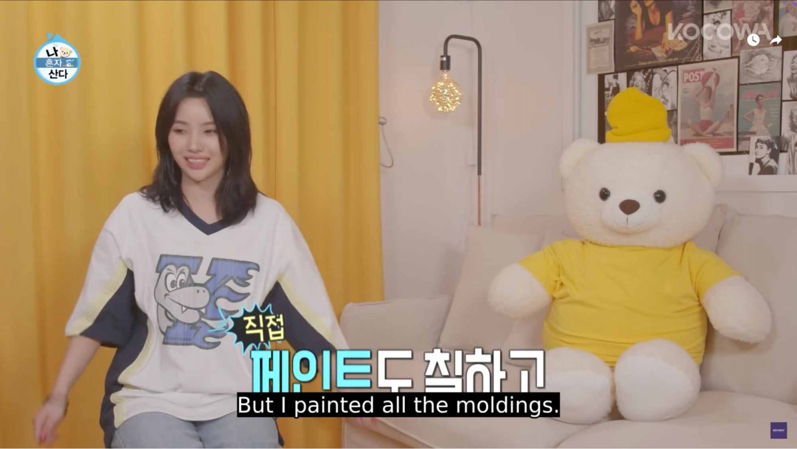 Soyeon sitting in her yellow-themed living room (Photo: Youtube / MBC World)
