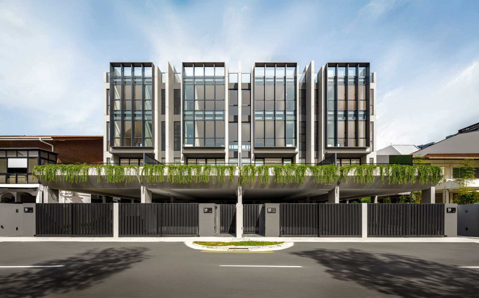 The street-facing facade of the quartet of terrace houses at Lorong 108 Changi
