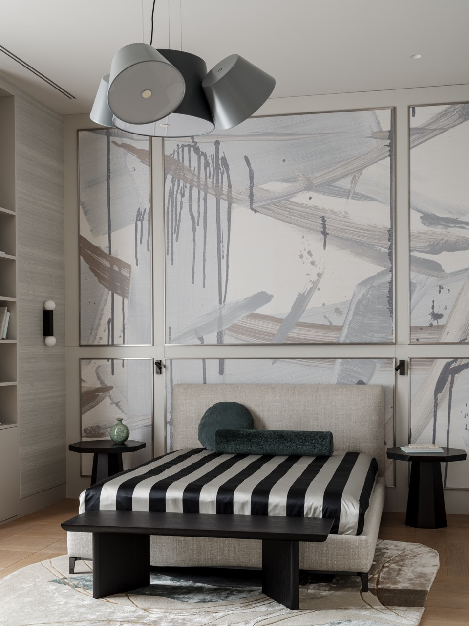 Son's bedroom with full-height wallpaper panels, custom bench at foot of bed, and clustered pendant lighting by Marset.