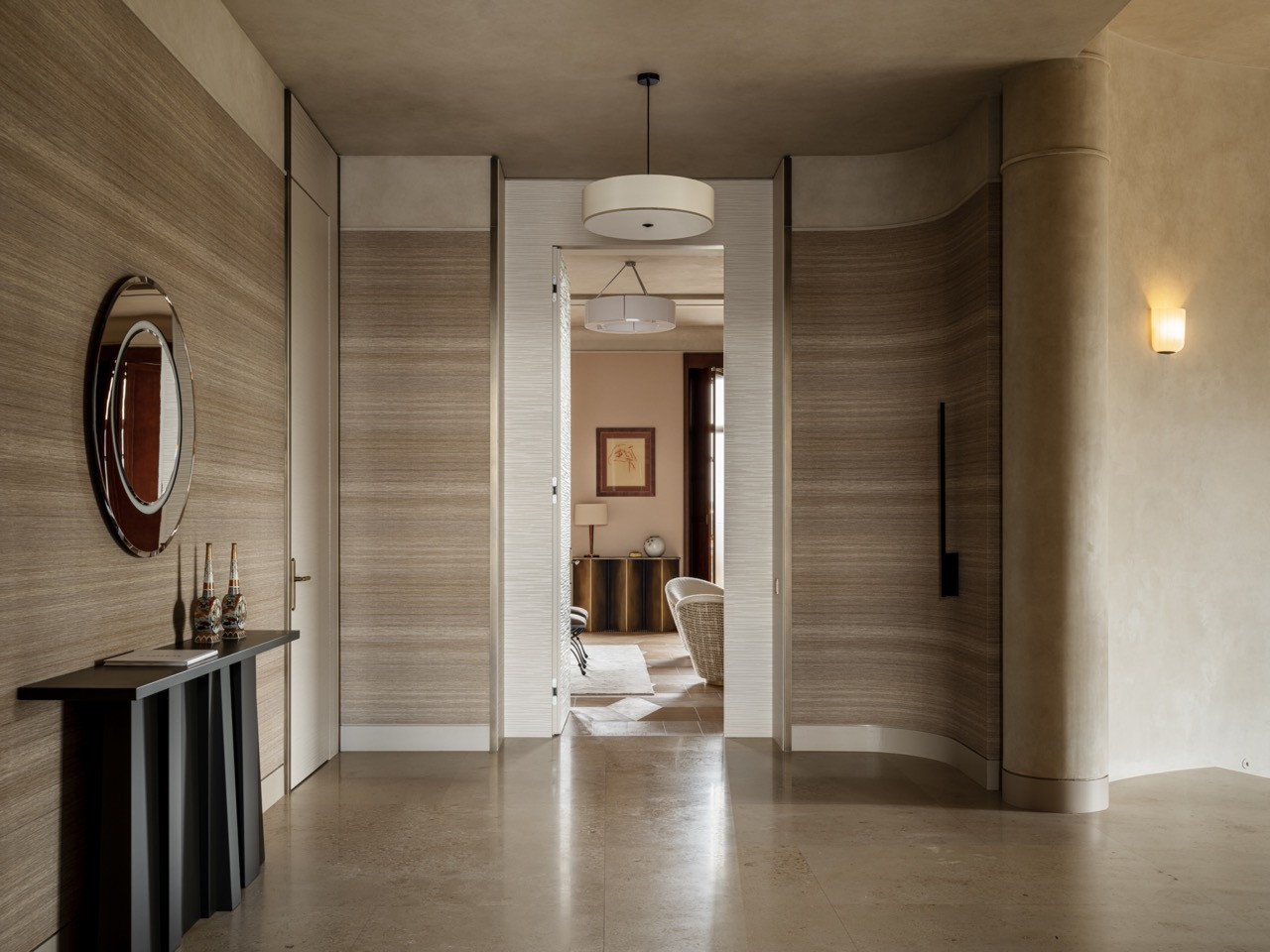 Master suite corridor with oak veneer cabinetry, Tafla C2 polished stainless steel mirror by Zieta, and a view through to the master bedroom with a painting by Georgy Artemov