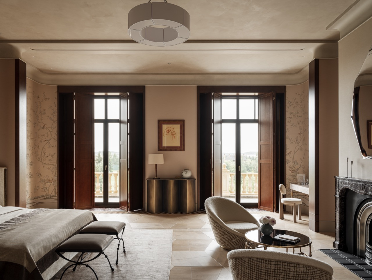 Full view of 49-square-metre master bedroom showing French doors to balcony, painting by Georgy Artemov, vintage Milo Baughman seating area, and Rosso Levante fireplace