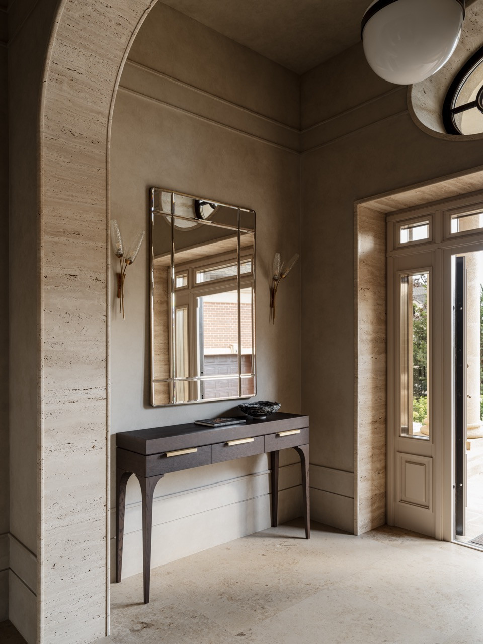 The Hallway entrance features a custom console with brass handles and legs
