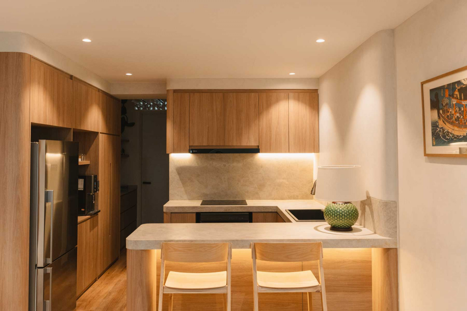 The kitchen features countertops in Taj Mahal quartzite