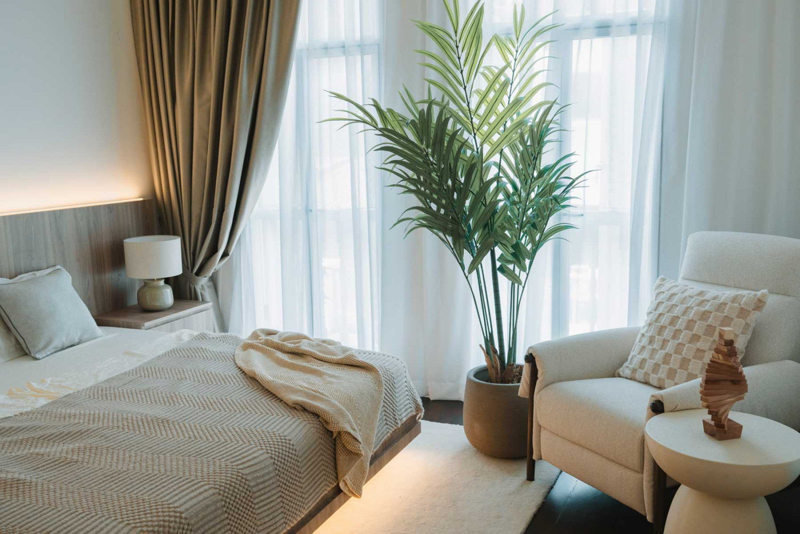 The cosy bedroom features a floating bed frame with LED lighting and automated drapes by Curtain Suite