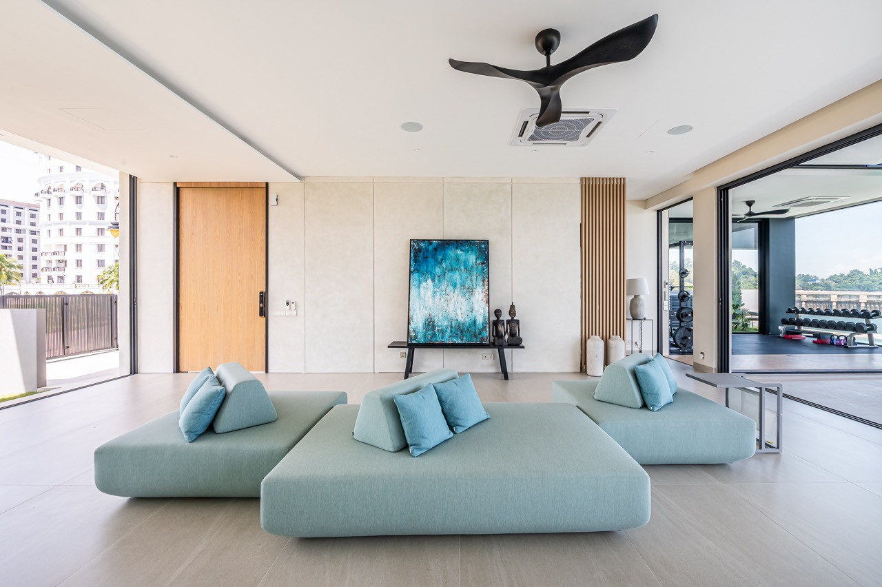 Modular turquoise seating invites lounging rather than formal sitting