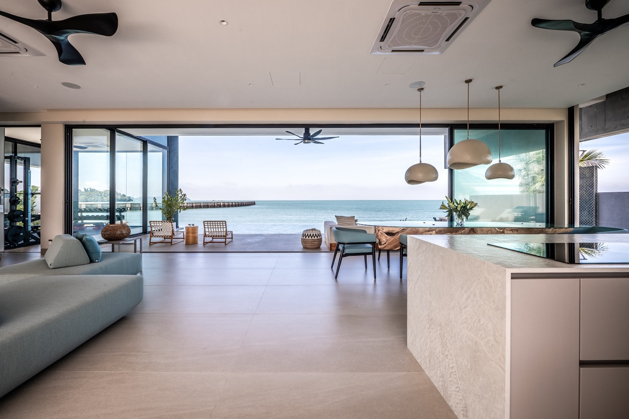 Natural materials including woven baskets and timber furniture temper the concrete and steel architecture