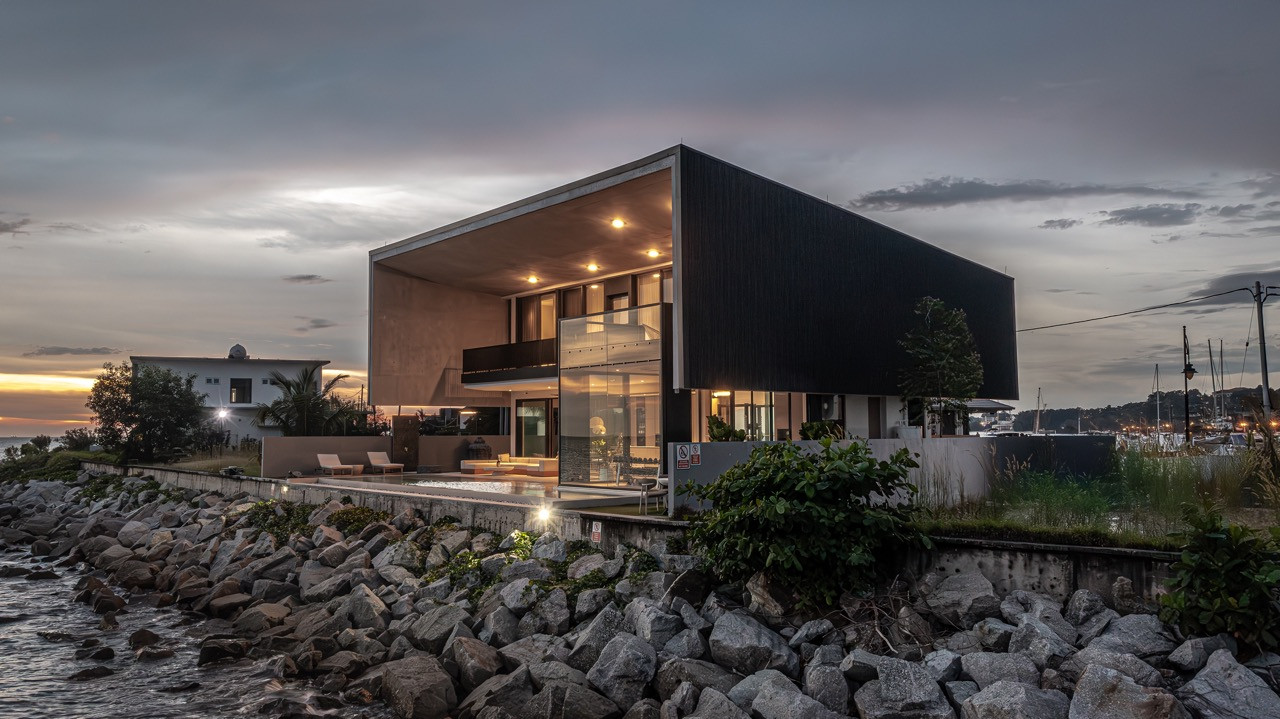 The bold architectural gesture of this Port Dickson coastal retreat makes a distinctive impression against the dramatic seascape