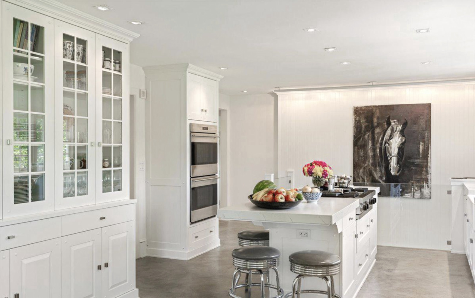The main house’s kitchen has a minimalistic palette (Photo credit: Compass)