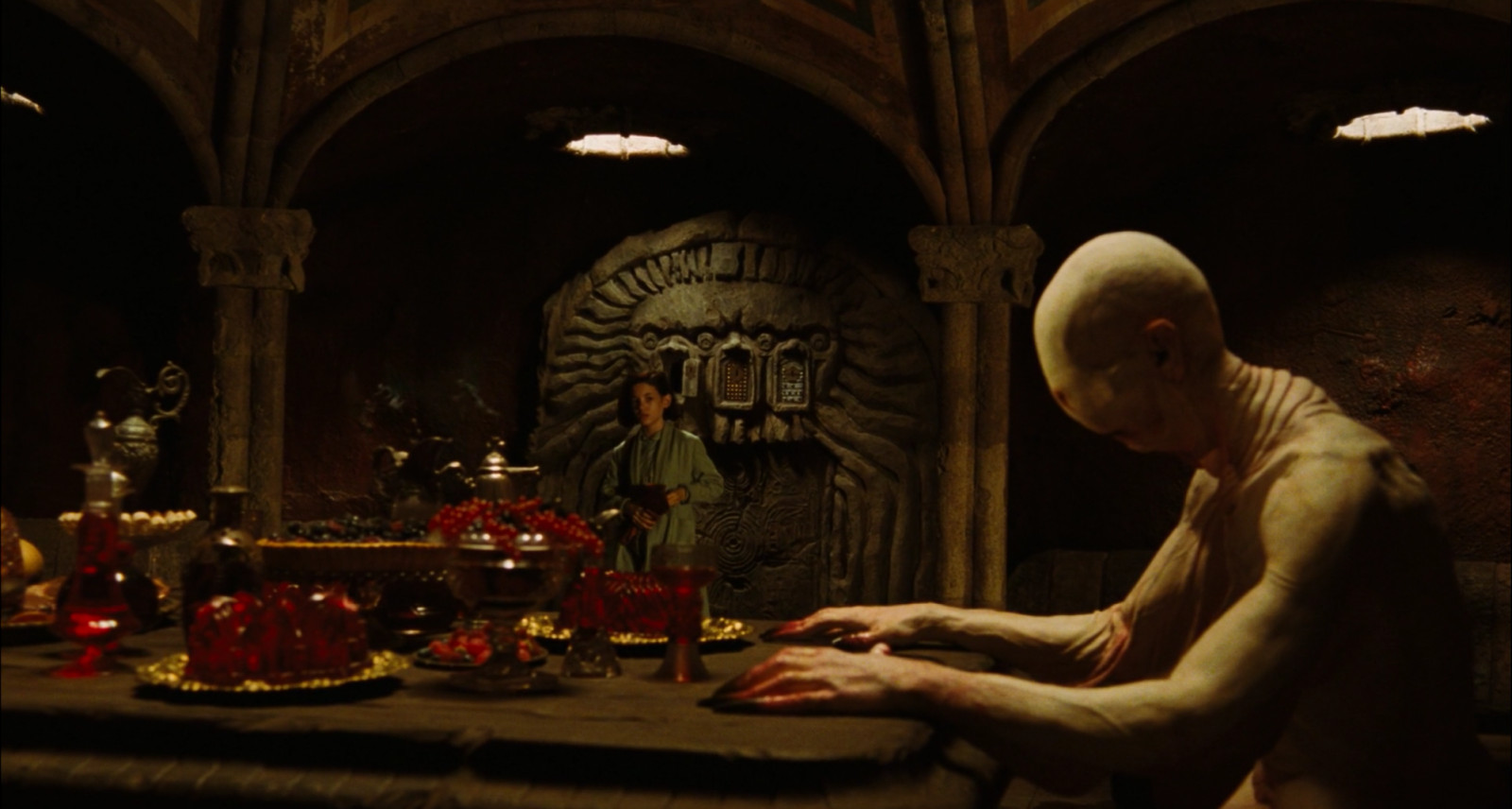 The famed banquet room with vaulted ceiling, fresco-like wall murals, and arched corridors (Photo: Warner Bros Pictures)