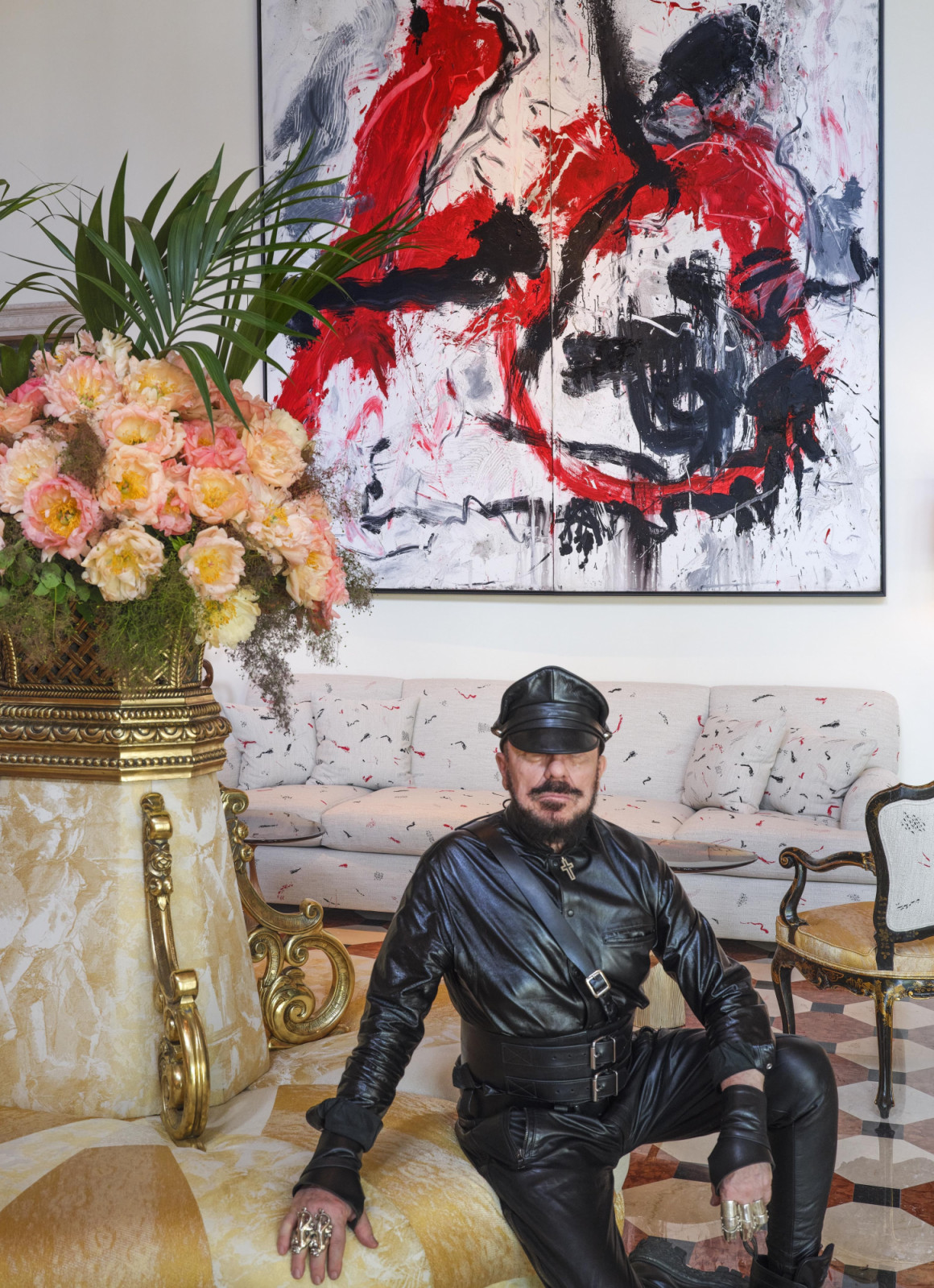 Peter Marino in one of the renovated Hotel Cipriani suites, beneath a large-scale abstract expressionist work from his curated art collection