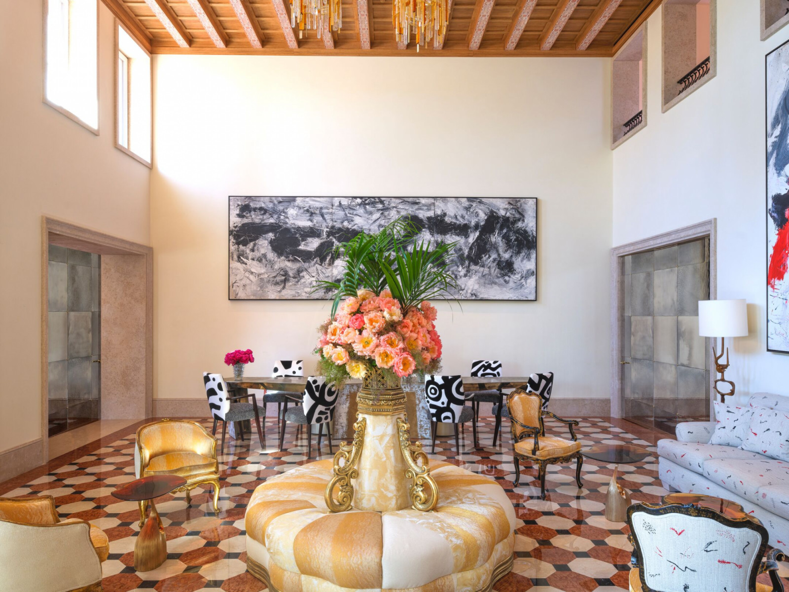 The new double-height lobby features terrazzo flooring, contemporary Italian abstract expressionist paintings, and a gilded circular banquette