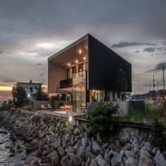 The bold architectural gesture of this Port Dickson coastal retreat makes a distinctive impression against the dramatic seascape