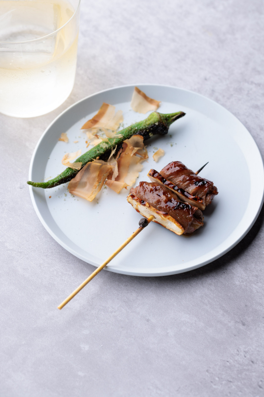 A duet of Wagyu-wrapped matsutake and chilled okra, paired with a whisky highball from the collaboration dinner