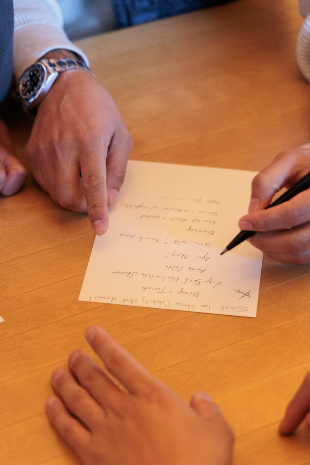 With just a few hours to go, the chefs gather around the table to discuss their collaboration dinner menu