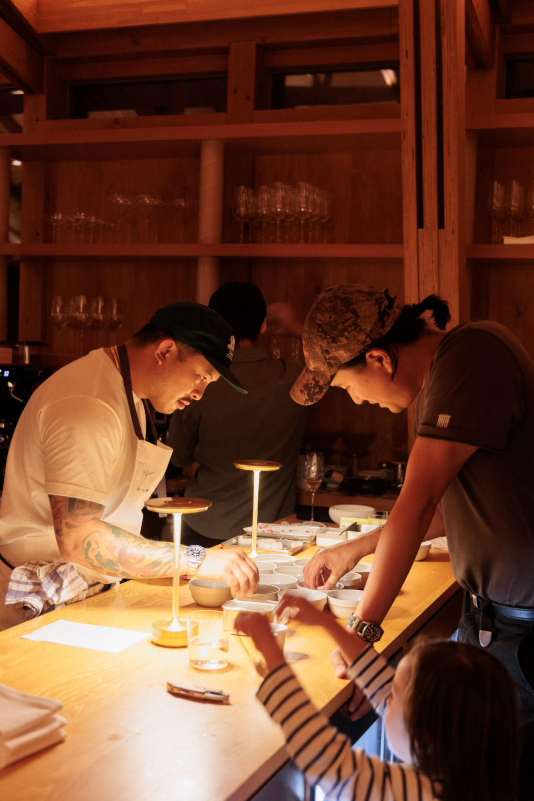 Chefs Tim Flores and Kyumin Hahn working in tandem