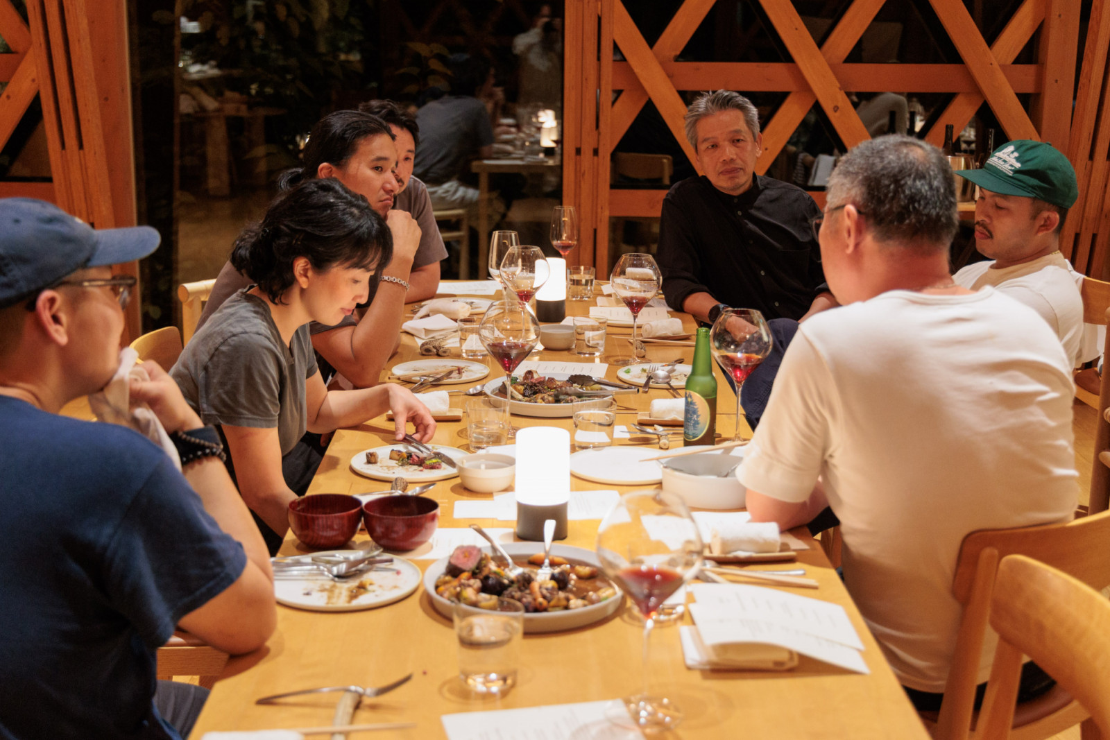 The chefs finally settle into their seats after a thrilling night of service
