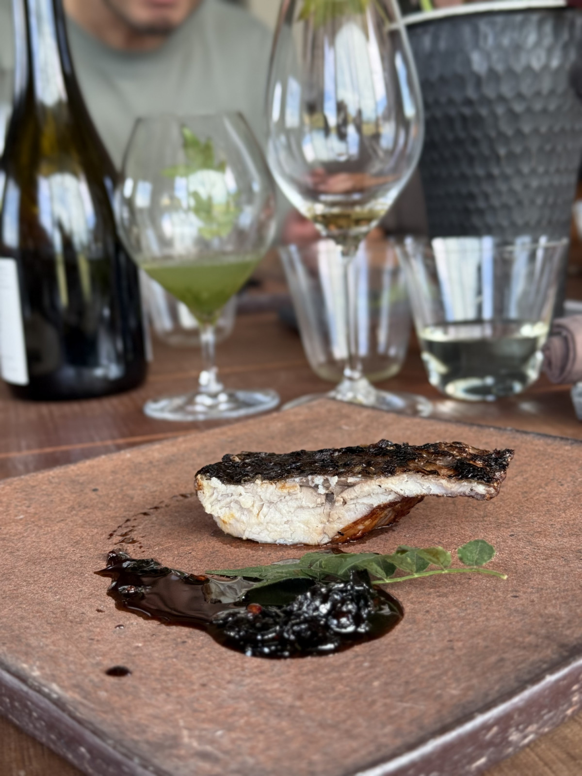 Carp cut honekiri-style, salted and soaked in red wine, then grilled and served with a sauce of leftover wine grapes, from Song restaurant