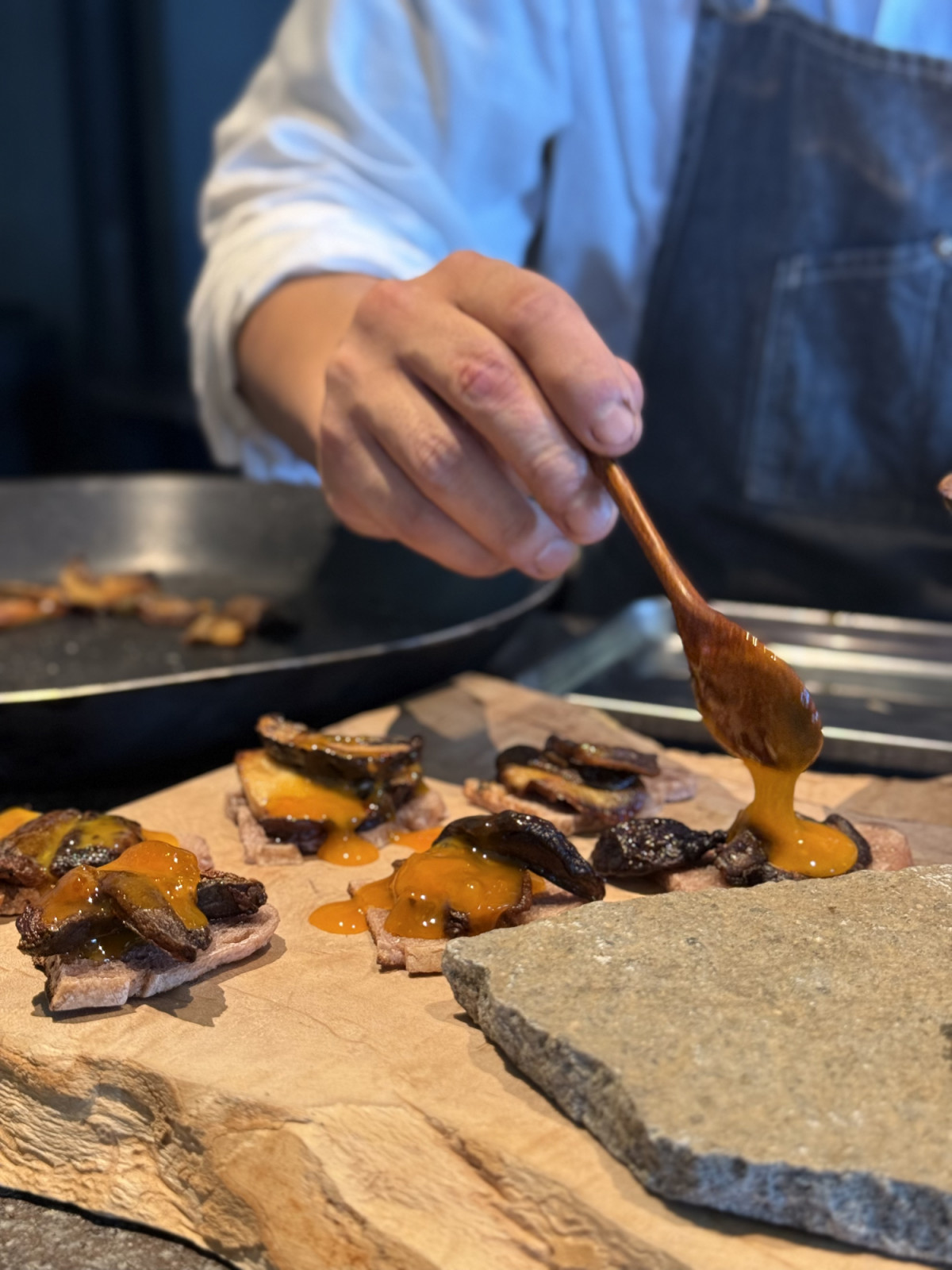 Porcini mushrooms on local grape bread, bathed with smoked egg yolk—the opening bite at Song restaurant (photo: Lauren Golangco)