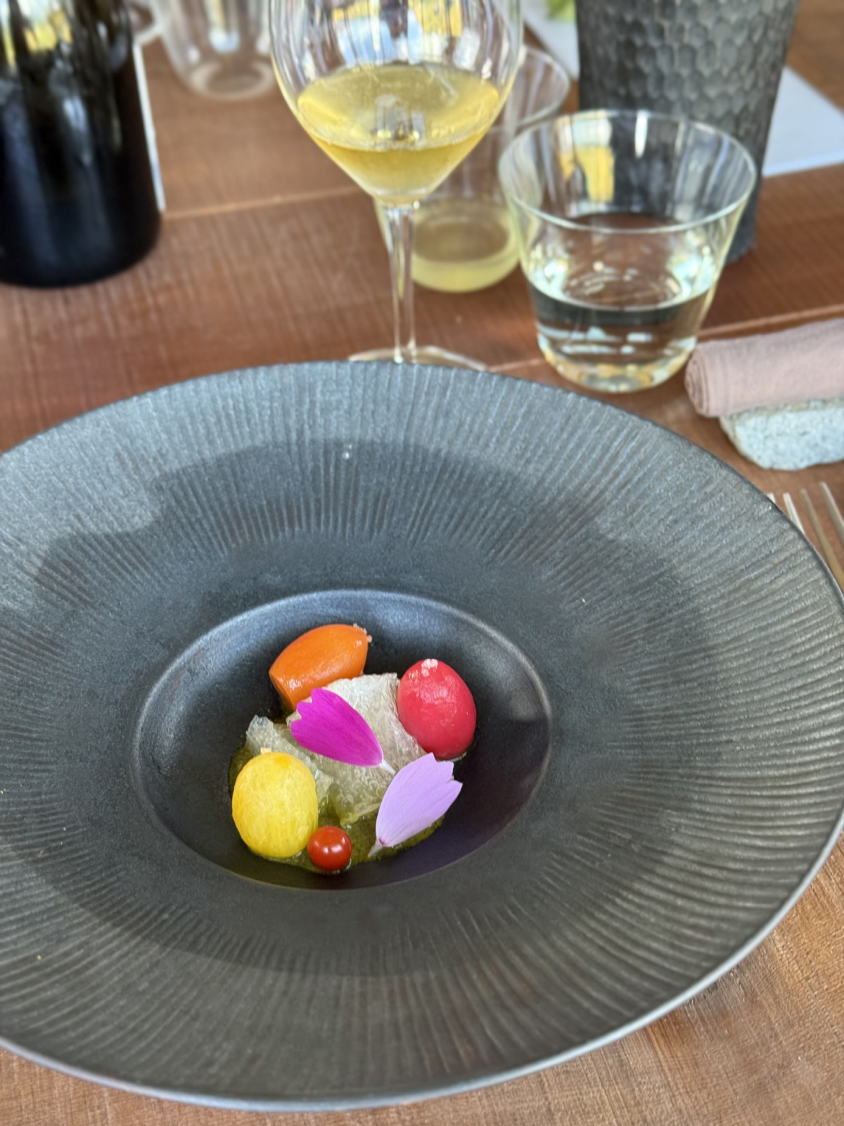 A dish from Song: kanten (agar-agar) soaked in tomato consomme served on a bed of sharp “pesto” made with shiso and fermented local vinegar (photo: Lauren Golangco)