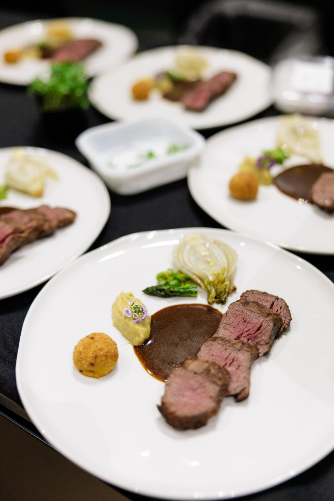 Pan-seared beef tenderloin and bourbon beef croquette with fennel confit