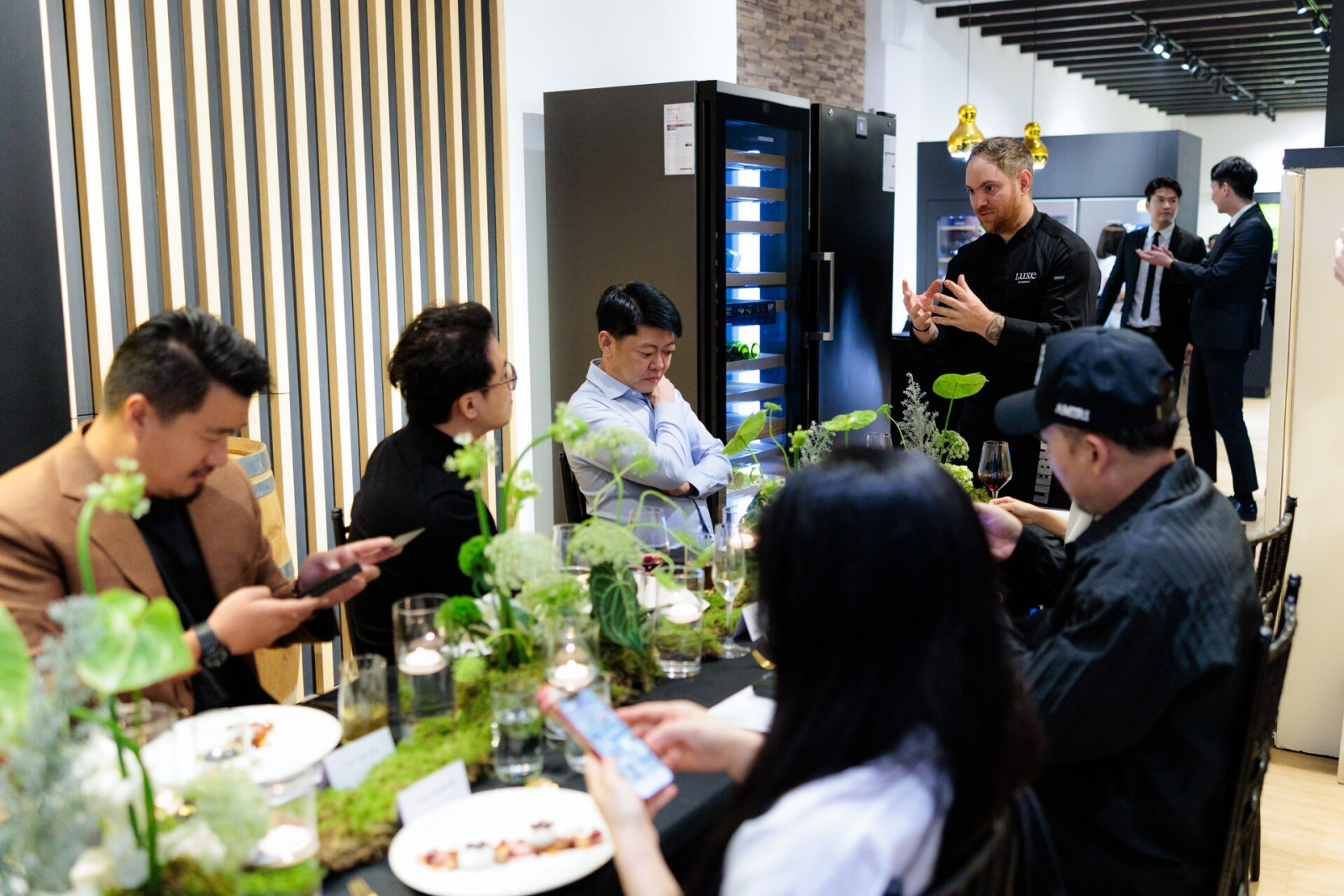 Chef Pierre Emmanuel Didier introducing dishes to guests