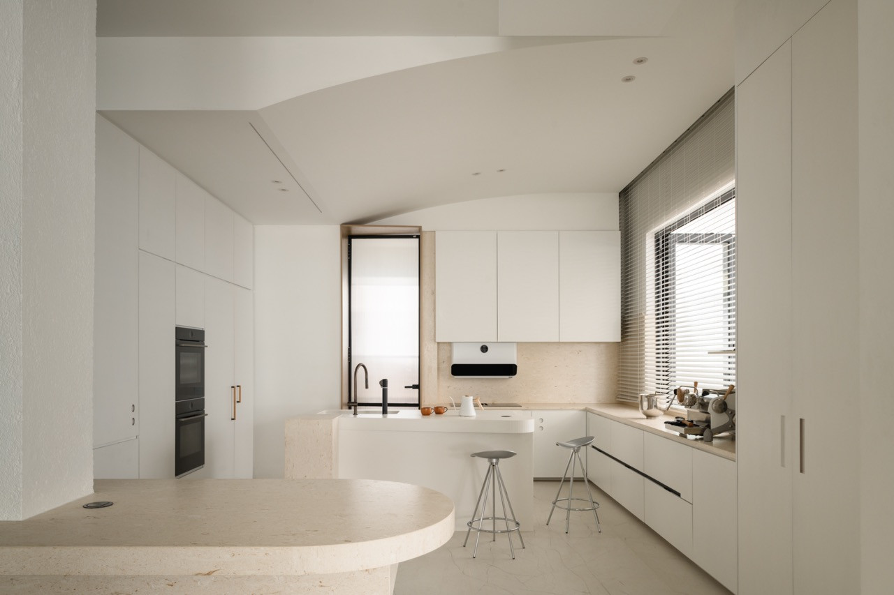The kitchen’s open layout encourages circulation flow