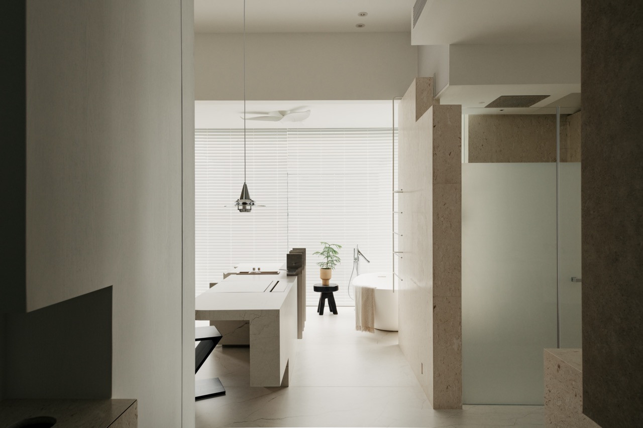 The open-plan master suite allows views from the bathroom through to the bathtub area