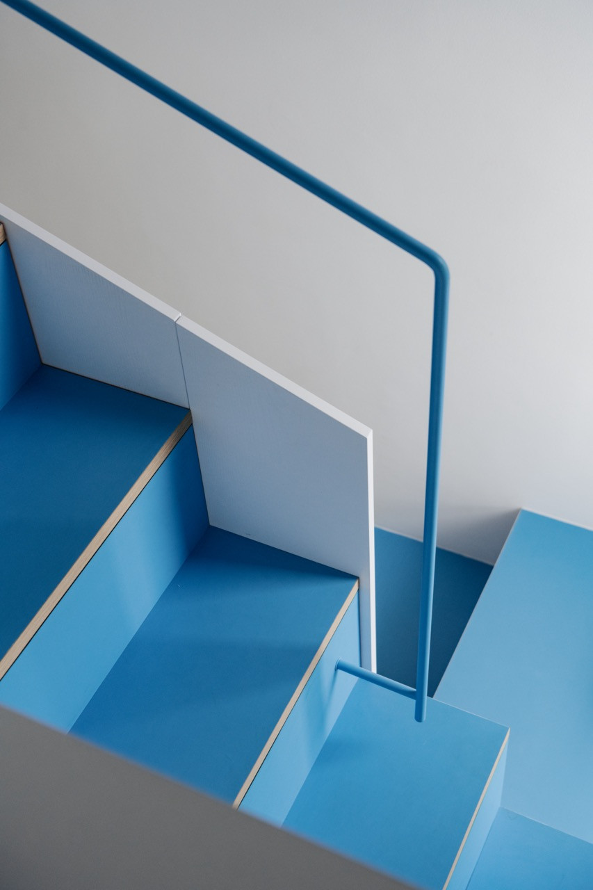 A detail of the blue staircase in the children’s area