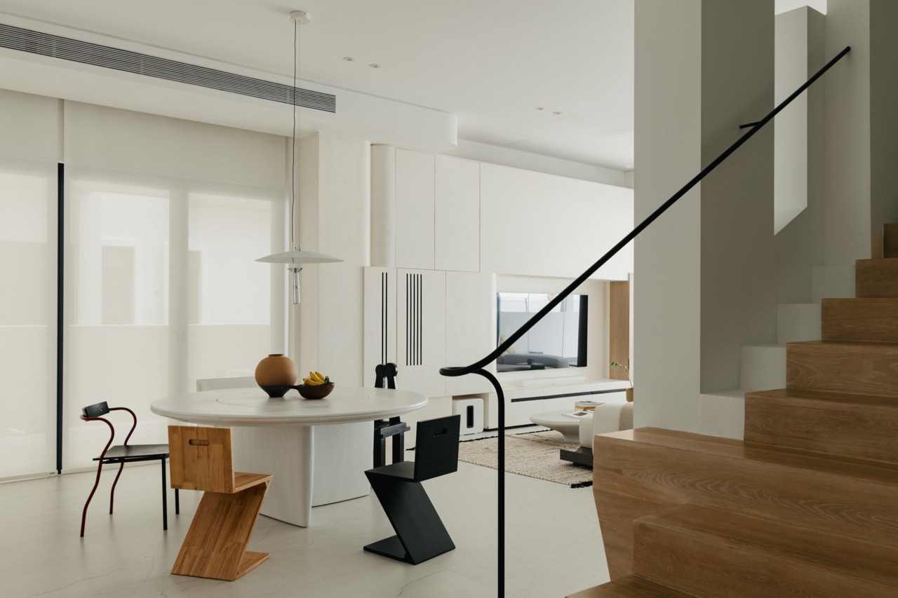 The open layout allows views from the dining area through to the living room