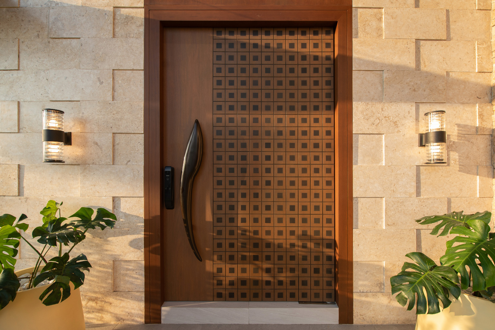 The front door of a tropical modern bungalow in Mexico, Pampanga, designed by Innovarc