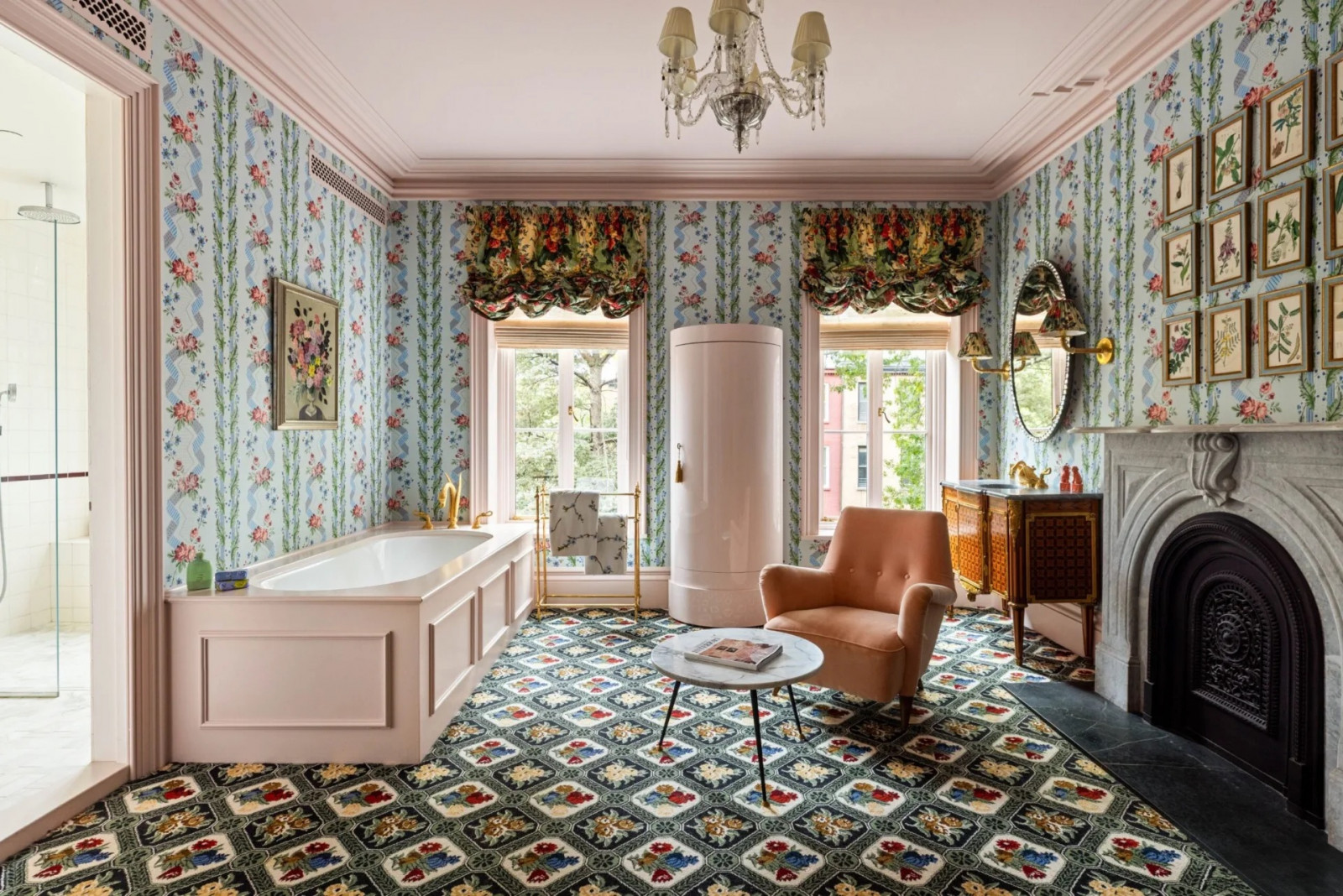 The primary ensuite features a built-in bathtub, fireplace, sitting area, and Pierre Frey carpeting extending around the tub (Photo: The Gambino Group)