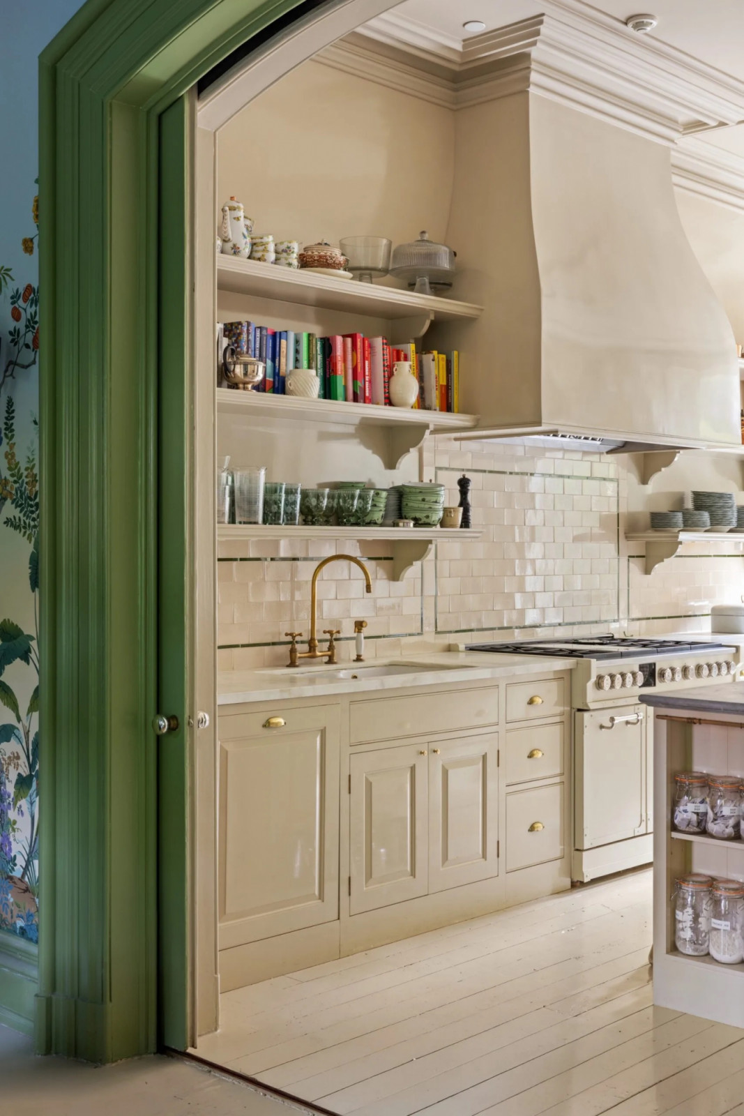 The Plain English kitchen features cream cabinetry, open shelving, and an Ann Sacks tile backsplash (Photo: The Gambino Group)