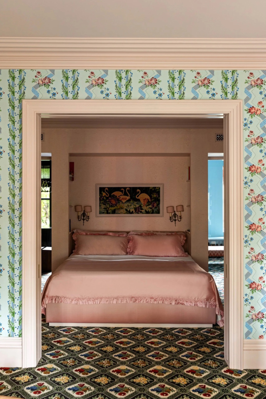 The windowless primary bedroom uses pale pink across walls and ceiling to create what Allen called a “bed-womb” effect (Photo: The Gambino Group)