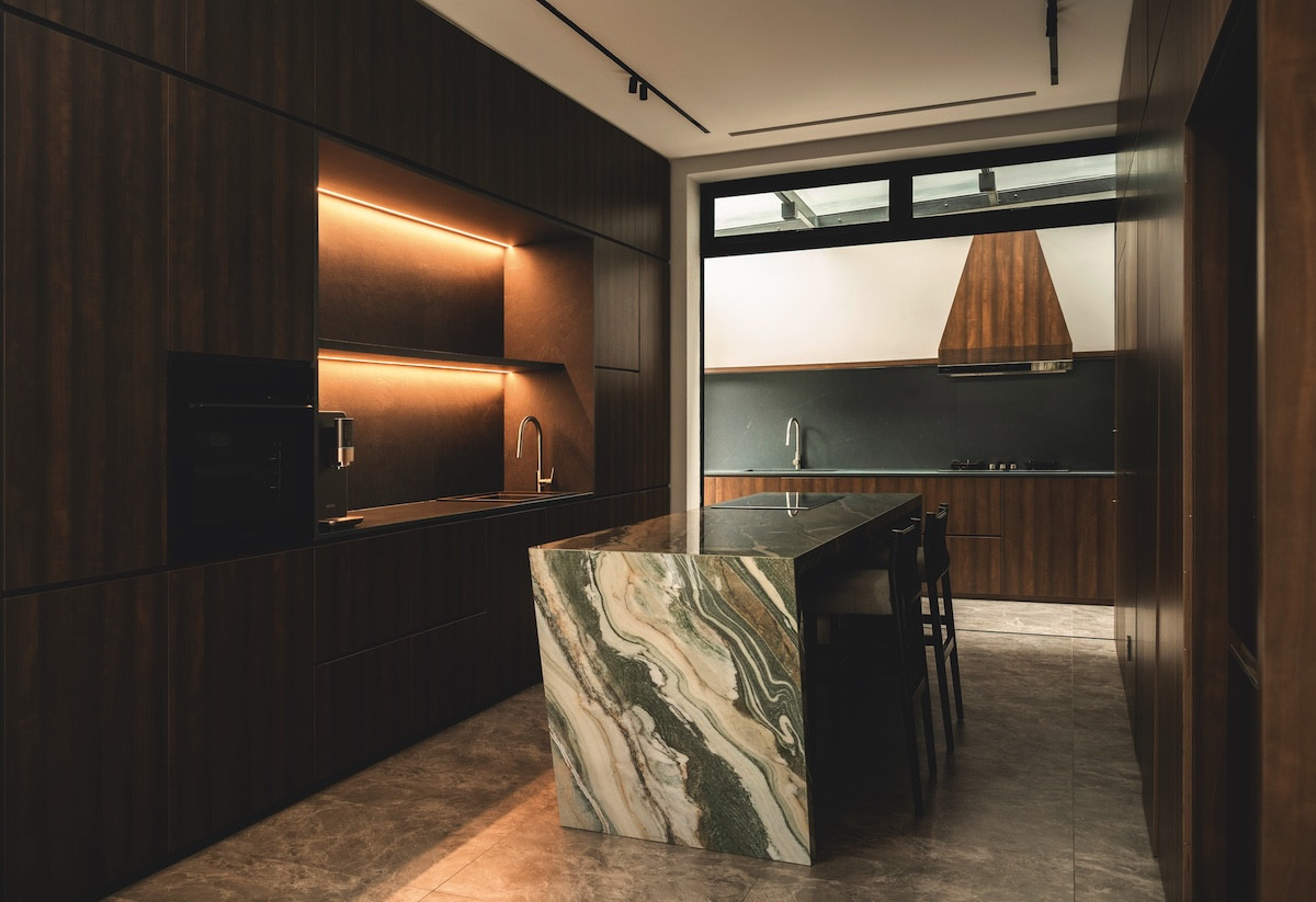 A marble breakfast island anchors the kitchen